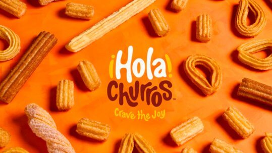 overhead shot of a variety of churros with Hola Churros logo